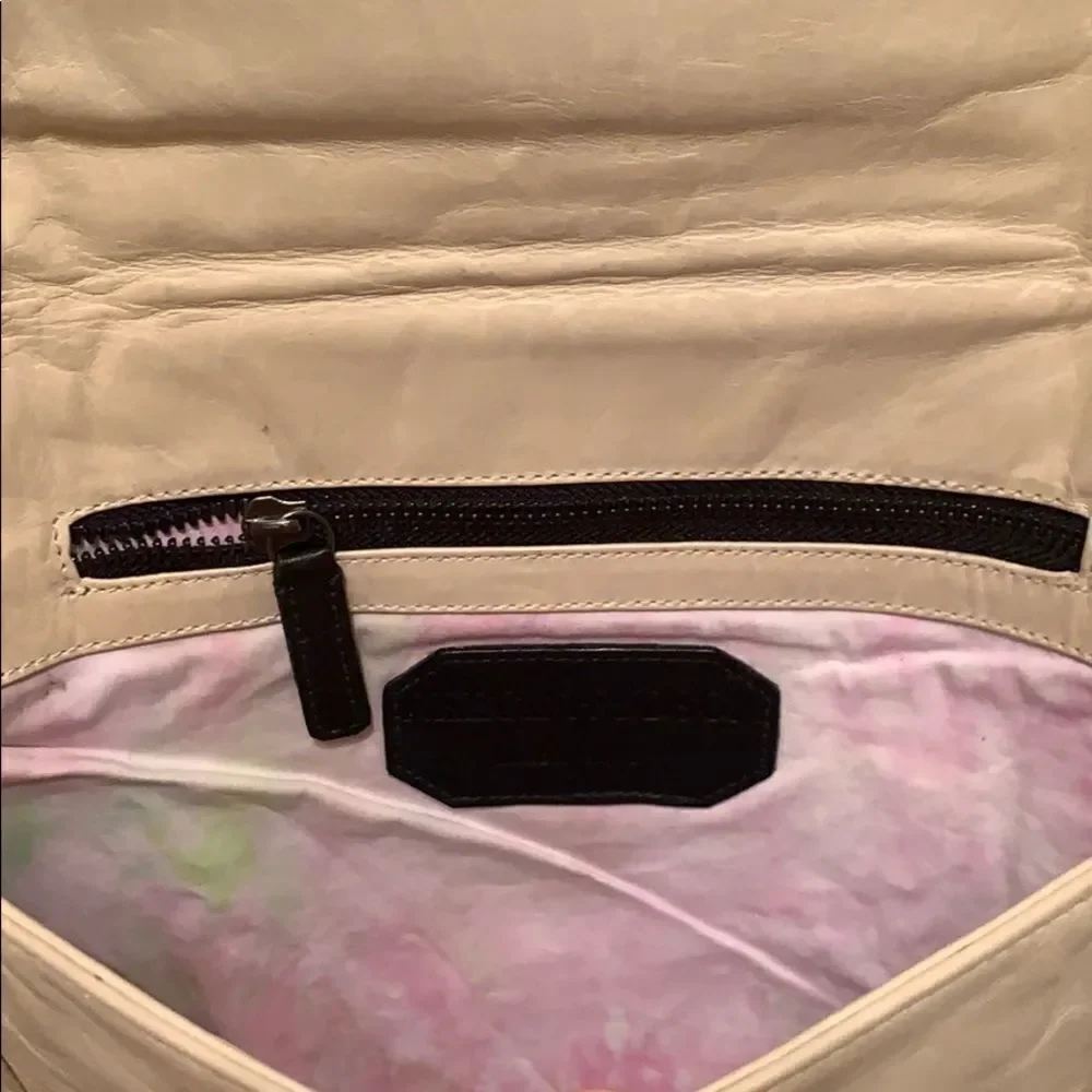 Reece Hudson cream colored clutch‎